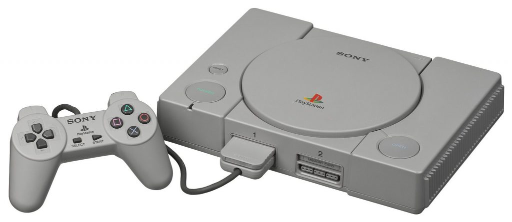 Grey original PlayStation SCPH-1000 console with its first digital controller