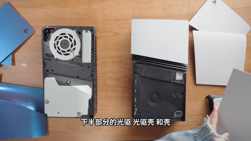 PS5 Pro with its outer side panels removed, showing the fan and internal cover