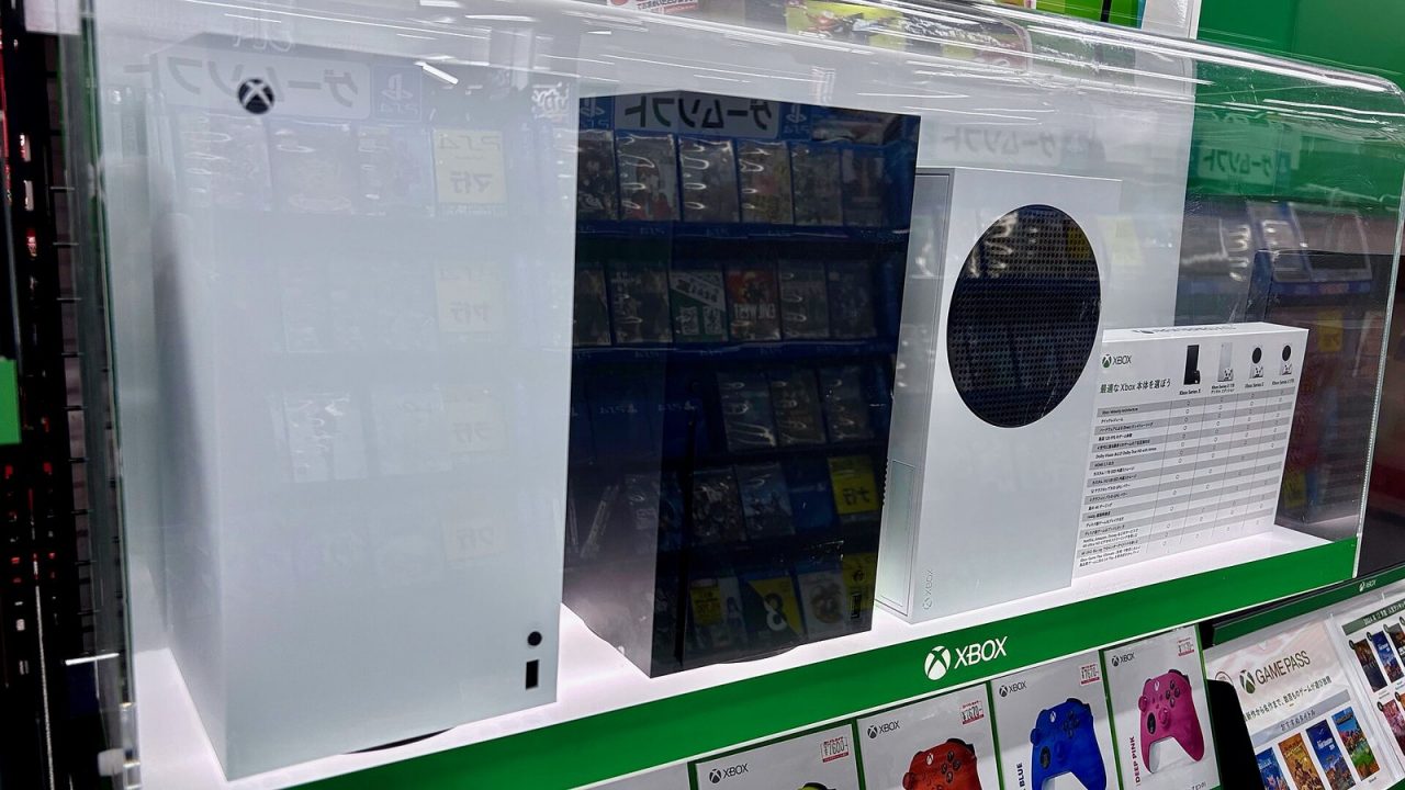 Boxed Xbox Series X and Xbox Series S consoles side by side on a store shelf