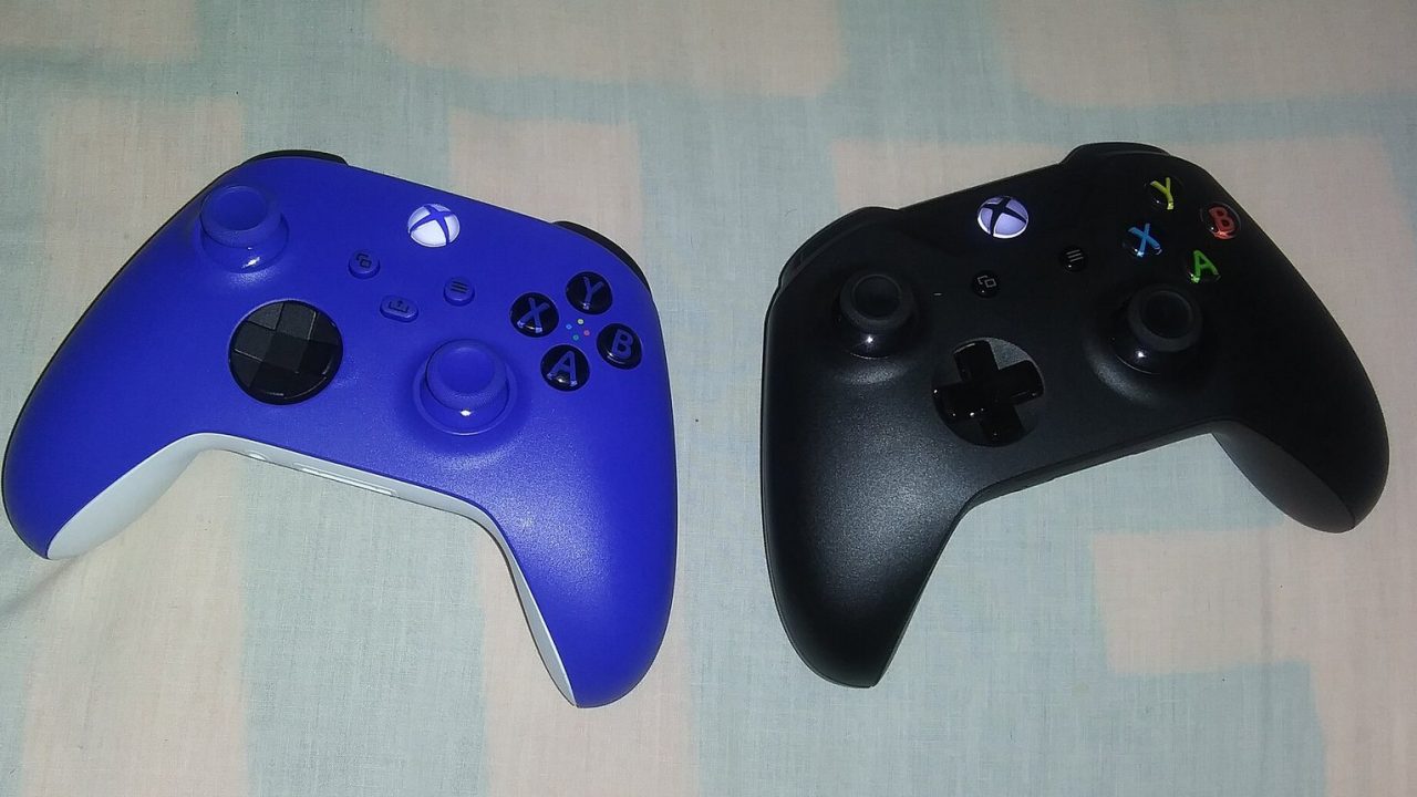 Blue Xbox Series controller next to a black Xbox One controller